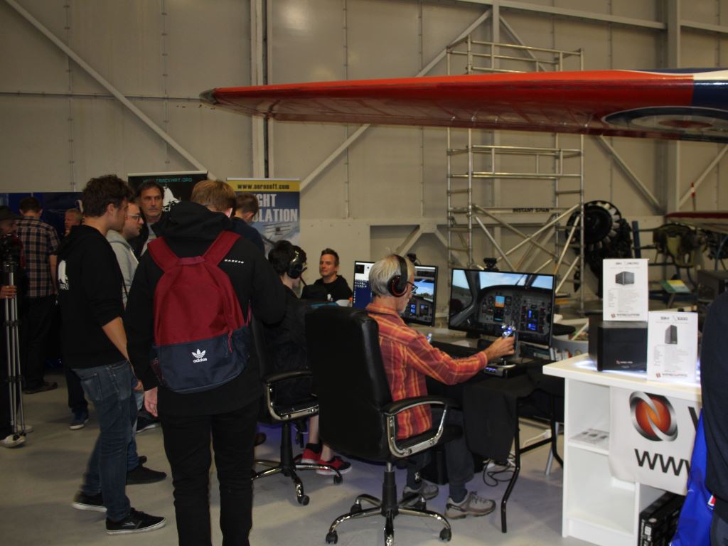 Visitors trying out flight sim on Wired2Fire PCs