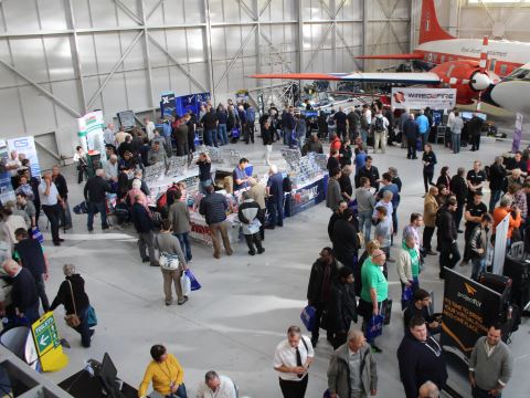 Looking down on the main exhibition area to see all stands busy with visitors