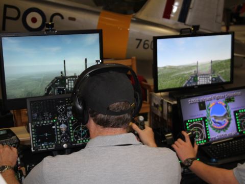 A couple of simmers flying jets with advanced control panels