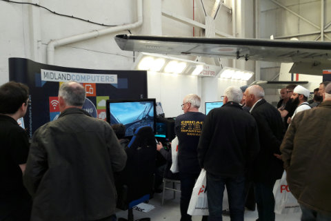A group of visitors checking out the systems on offer from Midland Computers