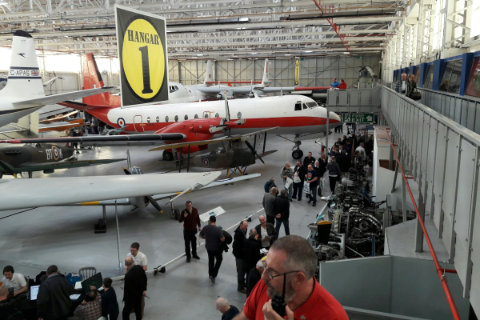 A look down the length of the hanger from the gantry, visitors making their way between stands