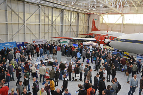 Looking down at the crowd of visitors in the hangar