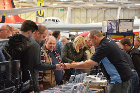 Visitors buying products at the Just Flight stand