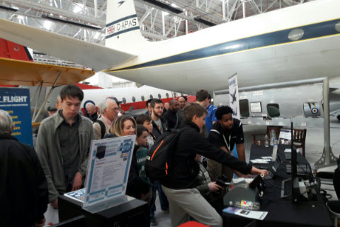 Visitors watching others try out the products on the QualityWings stand