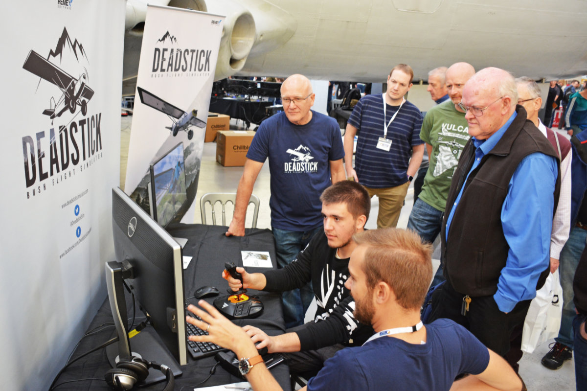 Visitors trying out the newly announced Deadstick Bush Flight Simulator