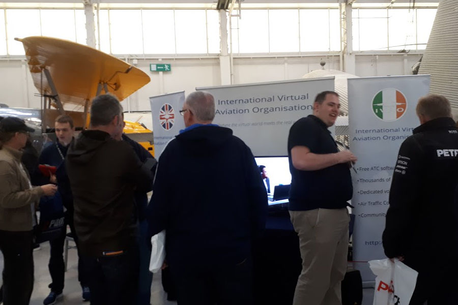 Visitors in discussion at the IVAO stand