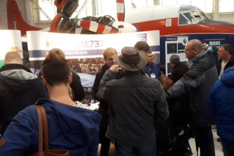 Visitors in discussion at the ProSim stand
